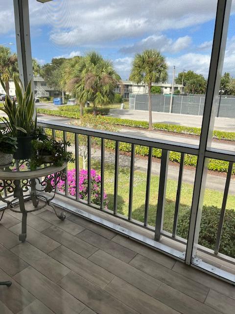 740 Monaco P, Unit P Delray Beach, FL 33446 - Photo 12 of 14 a view of swimming pool with a table and chairs