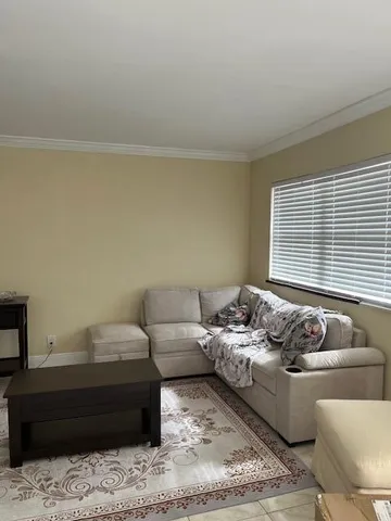 a living room with furniture and a window