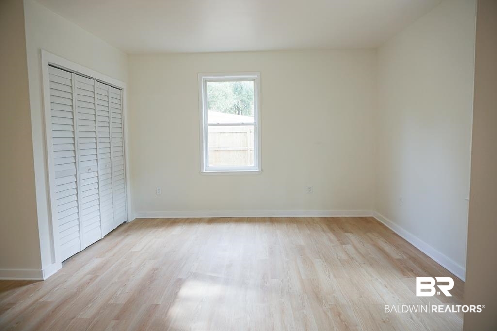 4667 Cottonwood Drive Mobile, AL 36608 - Photo 12 of 21 Unfurnished bedroom with light wood-type flooring