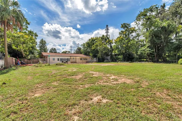 a view of a house with a big yard