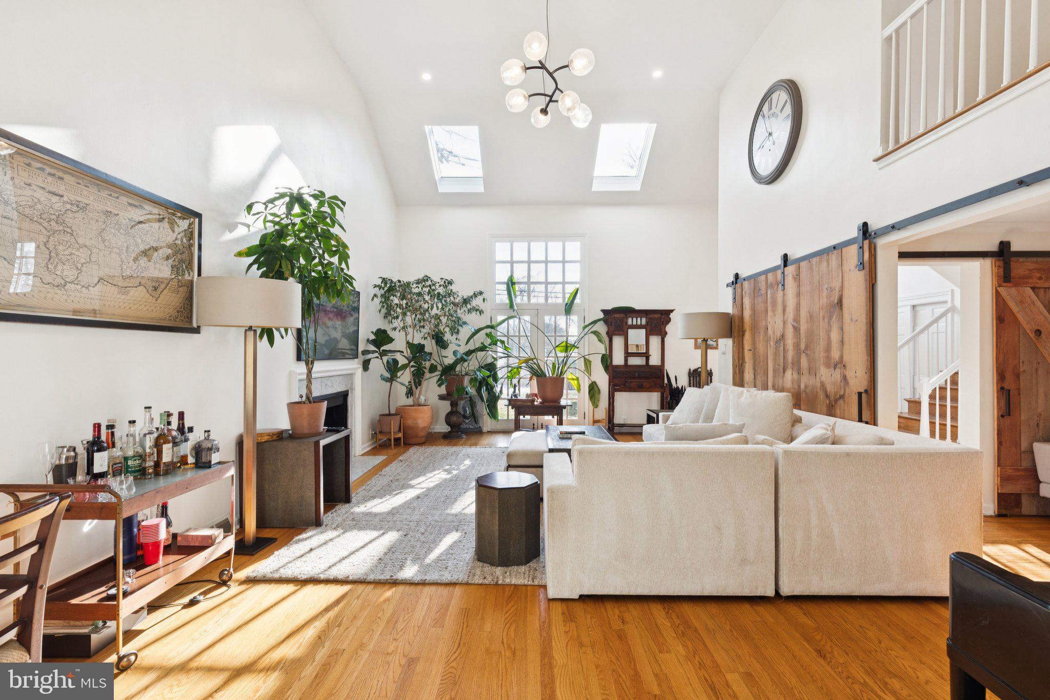 7713 Cherokee Street Philadelphia, PA 19118 - Photo 3 of 35 Light filled living room with vaulted ceilings