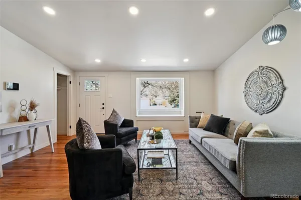 a living room with furniture and a window