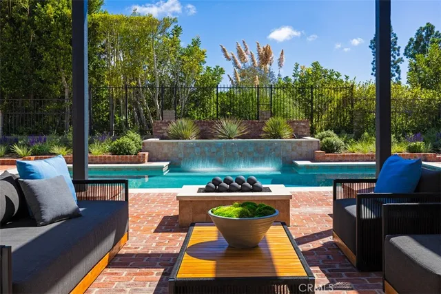a outdoor sitting area with furniture and a garden
