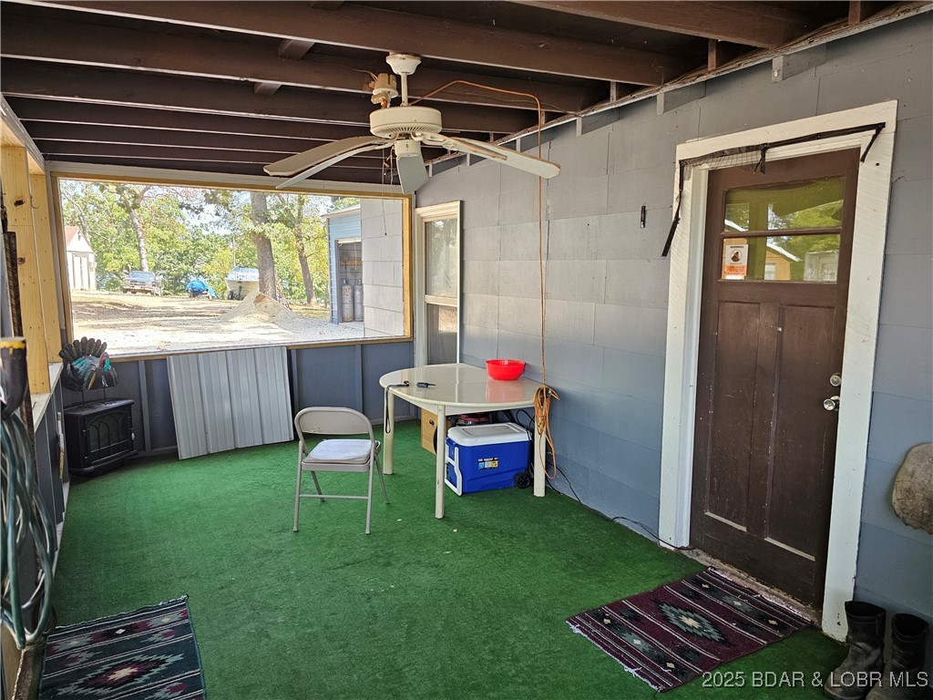 186 High Street Climax Springs, MO 65324 - Photo 16 of 20 20' x 10' Screened in patio/sunroom