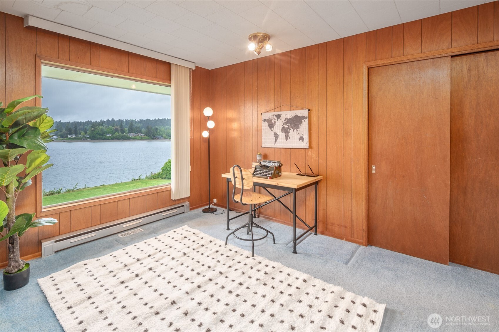 22617 Kingsbury Road Southwest Vashon, WA 98070 - Photo 16 of 29 a room that has a rug and a chair in it