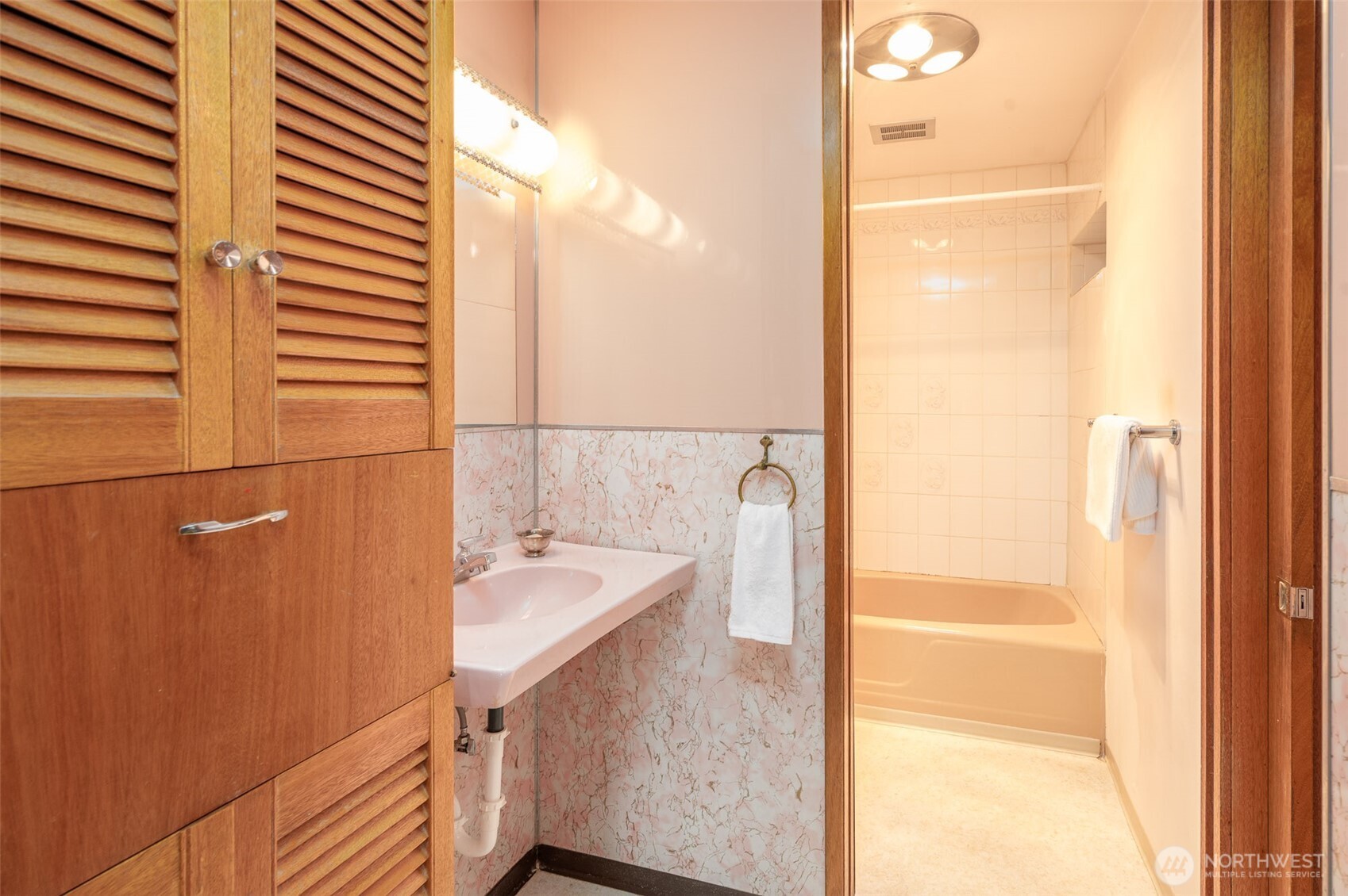 22617 Kingsbury Road Southwest Vashon, WA 98070 - Photo 17 of 29 a bathroom with a sink and a mirror