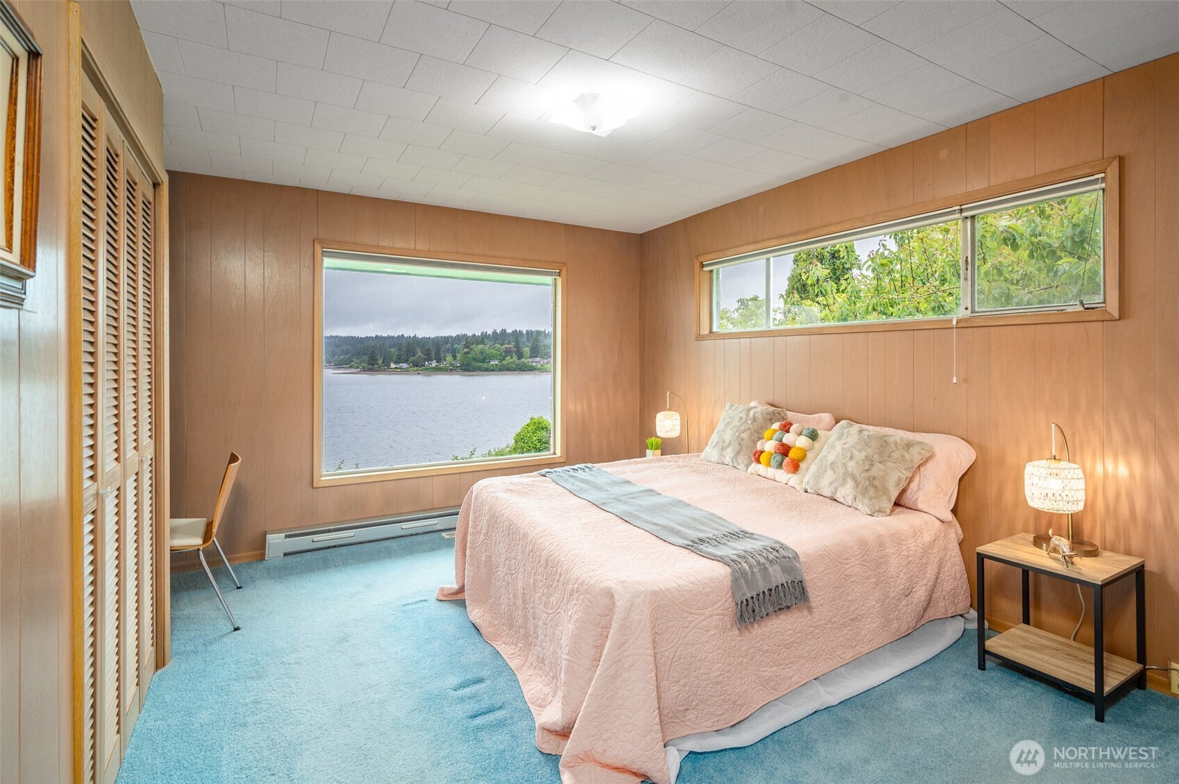 22617 Kingsbury Road Southwest Vashon, WA 98070 - Photo 18 of 29 a bedroom with a bed and a window