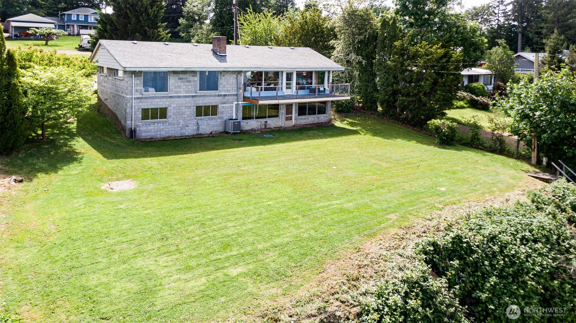 22617 Kingsbury Road Southwest Vashon, WA 98070 - Photo 3 of 29 a view of a house with a garden and deck