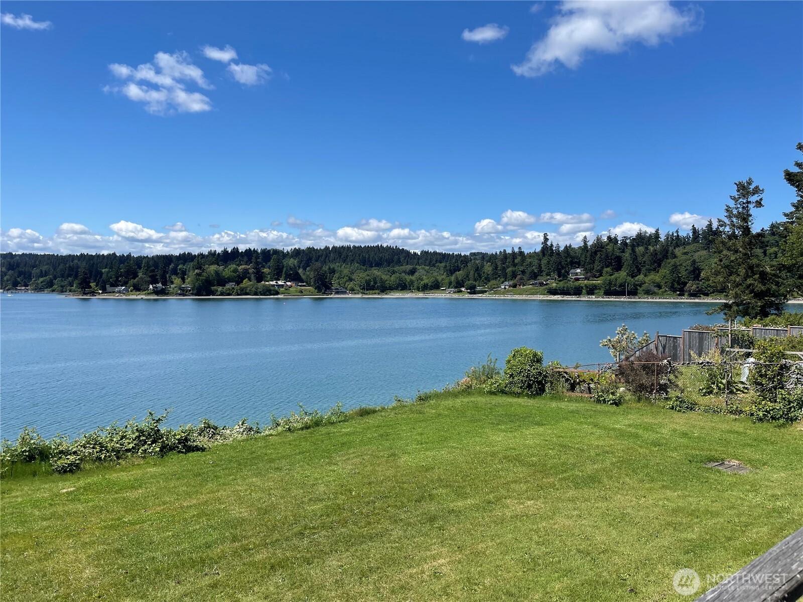 22617 Kingsbury Road Southwest Vashon, WA 98070 - Photo 7 of 29 a view of a lake with houses in the back