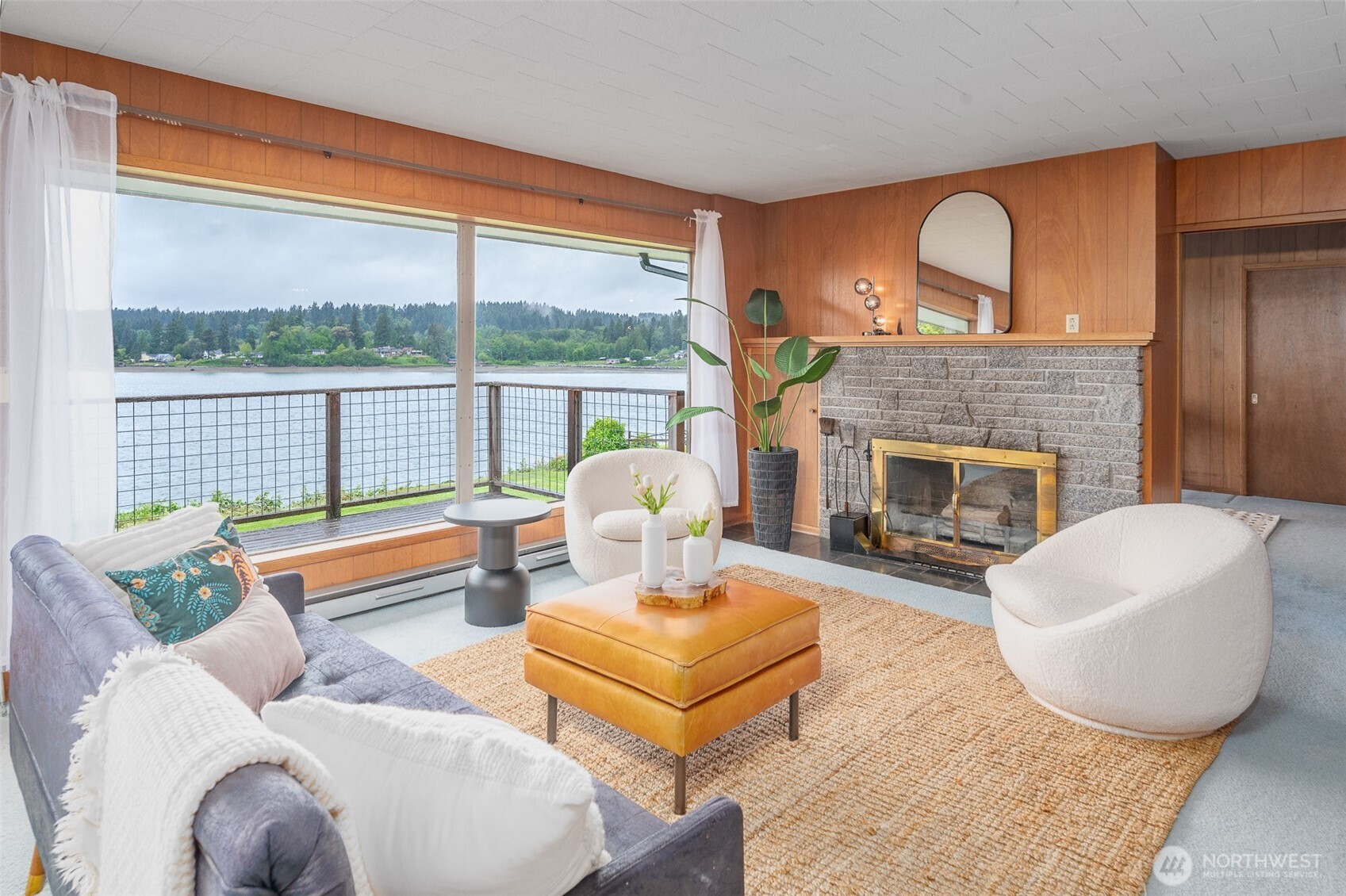 22617 Kingsbury Road Southwest Vashon, WA 98070 - Photo 9 of 29 a living room with furniture and a fireplace