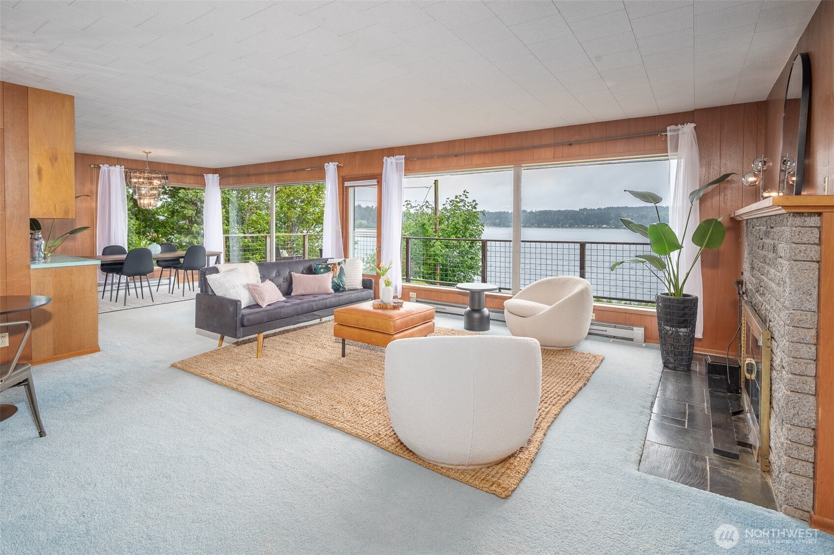 22617 Kingsbury Road Southwest Vashon, WA 98070 - Photo 10 of 29 a living room with fireplace furniture and a large window