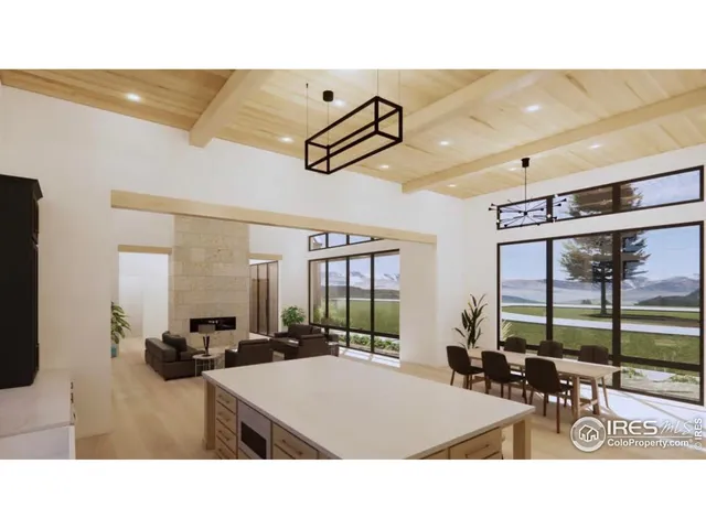 a kitchen with a table chairs and white cabinets