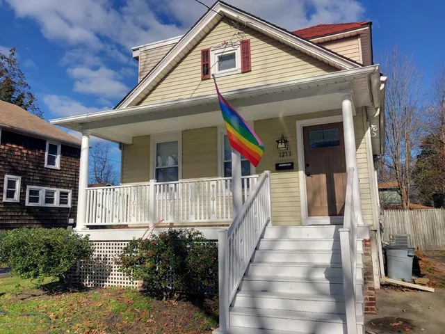 a front view of a house with a small yard