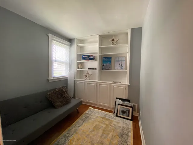 a living room with a couch and a window