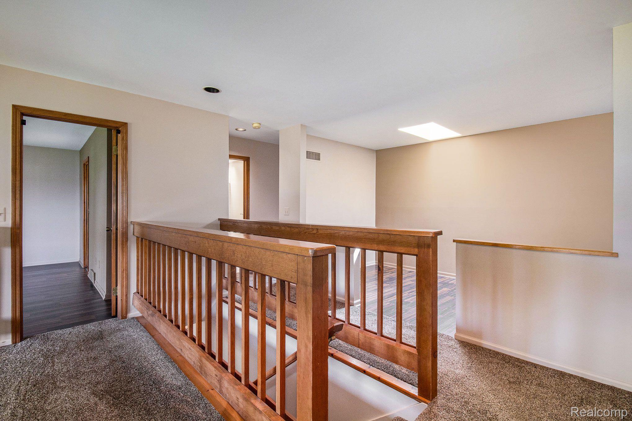 2210 Bowles Street Fenton, MI 48430 - Photo 18 of 33 Upper level hall leading to bedrooms & bonus