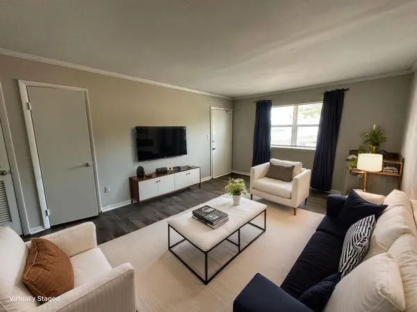 a living room with furniture and a flat screen tv