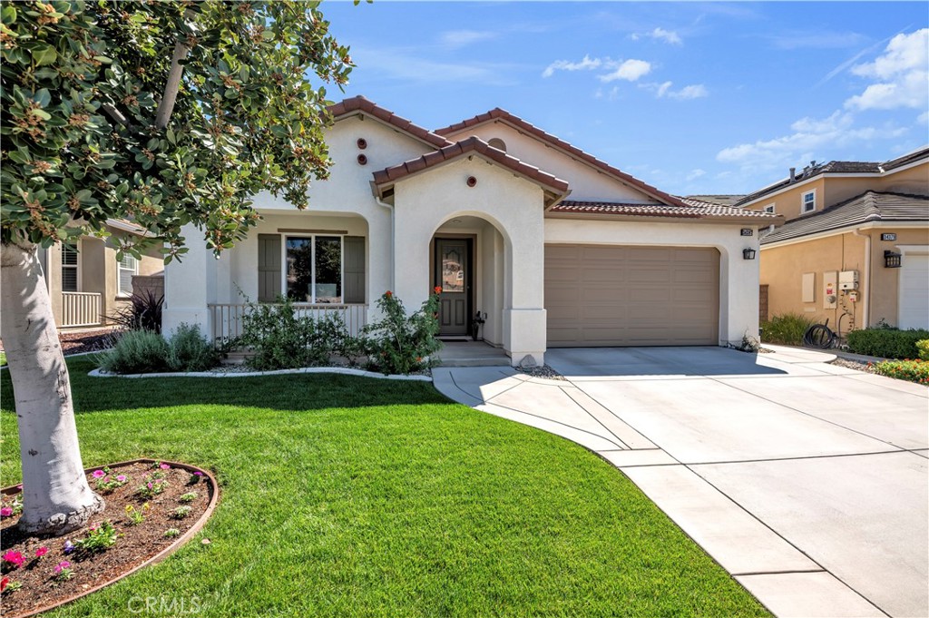 34387 Coppola Street Temecula, CA 92592 - Photo 1 of 1 a front view of a house with garden