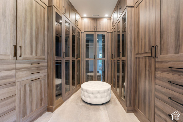 3652 South Cypress Road Hurricane, UT 84737 - Photo 43 of 81 Custom closet system featuring wood-finish cabinetry, integrated glass-front doors, built-in drawers, and recessed lighting