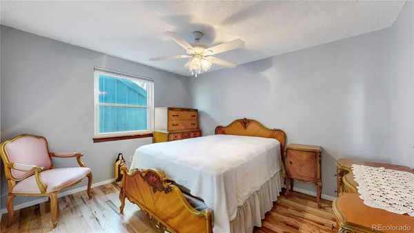 a bedroom with a bed and a chair