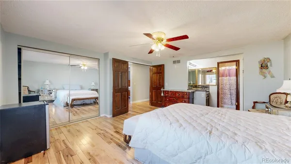 a bathroom with a sink vanity and a mirror