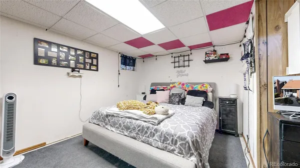 a bedroom with a bed and a closet