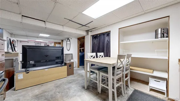 a view of outdoor sitting area with furniture and wooden floor