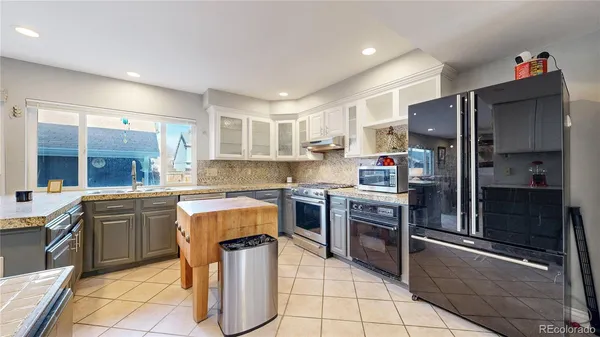 a kitchen with cabinets and stainless steel appliances