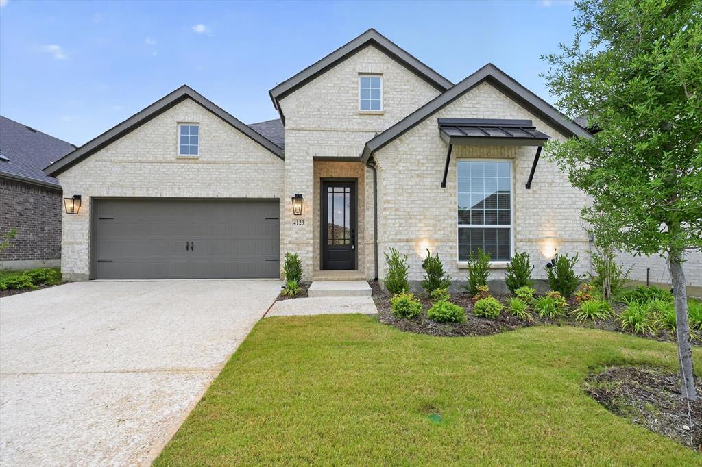 4123 Windy Point Court Oak Point, TX 75068 - Photo 10 of 29 Modern single-story residence featuring light-colored brick exterior