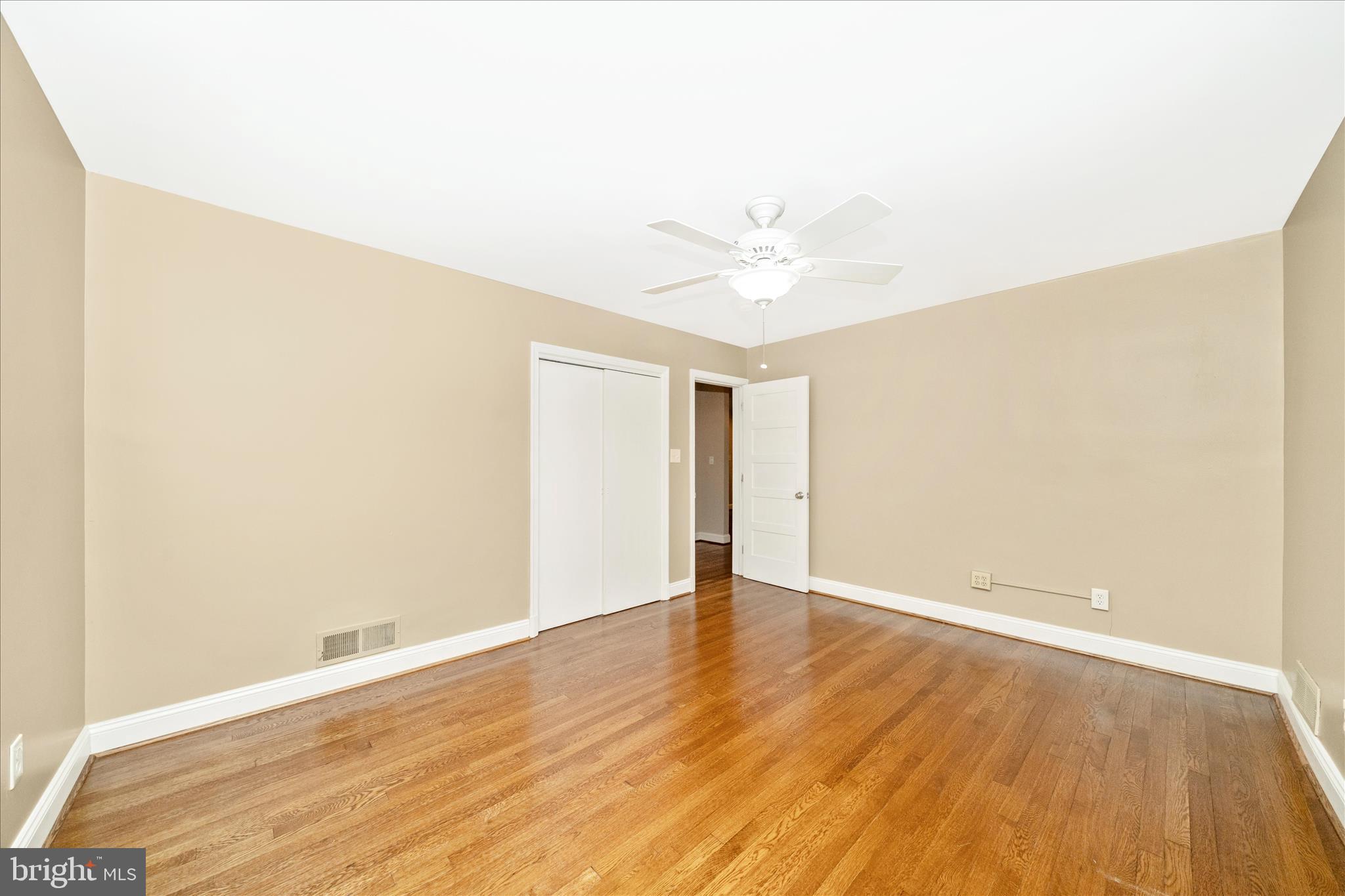 1925 Pagebrook Road Silver Spring, MD 20903 - Photo 22 of 60 a view of an empty room with wooden floor