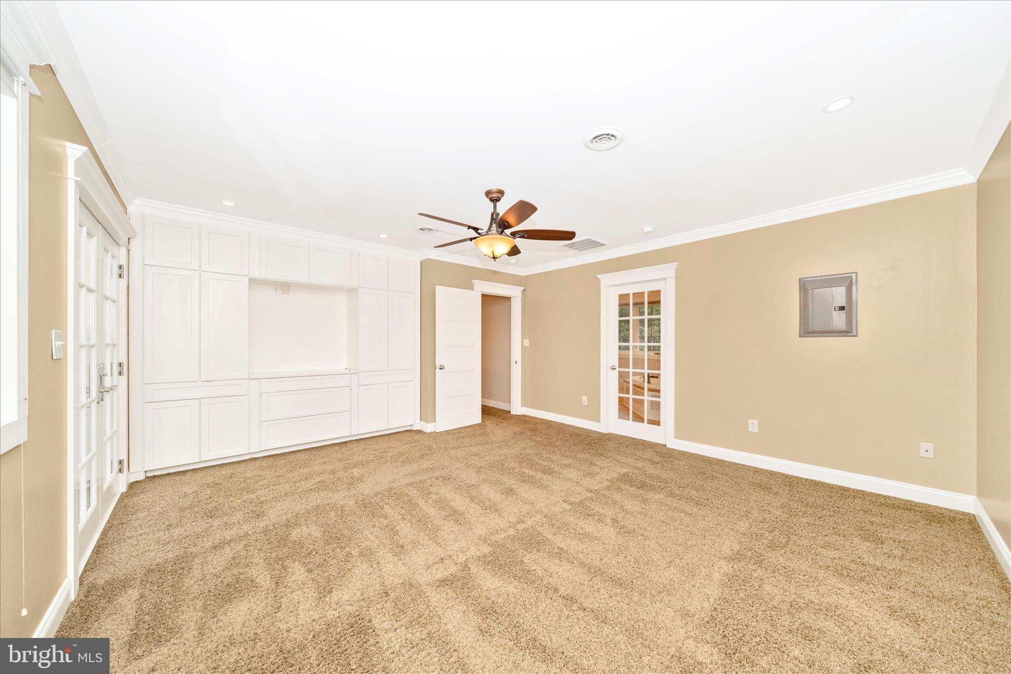 1925 Pagebrook Road Silver Spring, MD 20903 - Photo 25 of 60 a view of an empty room with a ceiling fan