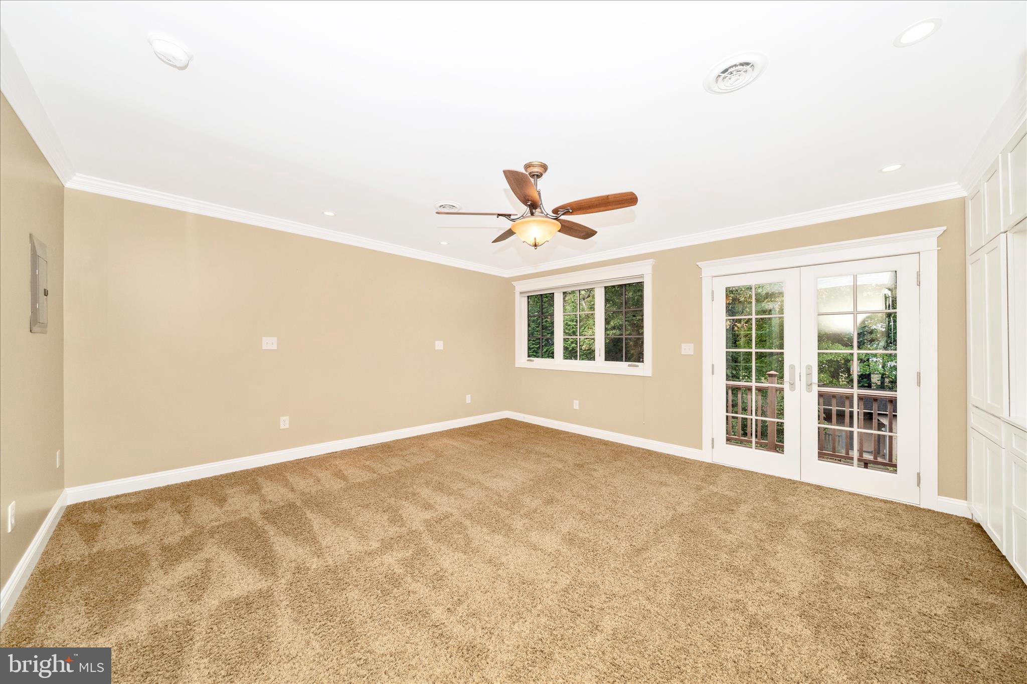 1925 Pagebrook Road Silver Spring, MD 20903 - Photo 26 of 60 an empty room with window and ceiling fan