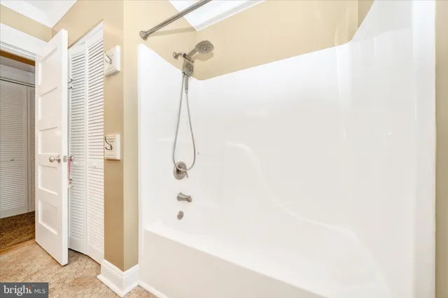 a bathroom with a toilet a sink and a mirror