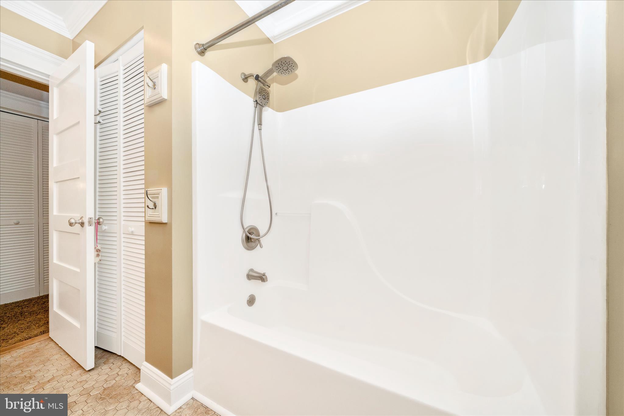 1925 Pagebrook Road Silver Spring, MD 20903 - Photo 35 of 60 a bathroom with a bathtub and a shower