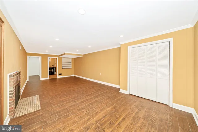 a view of balcony with wooden floor and fence