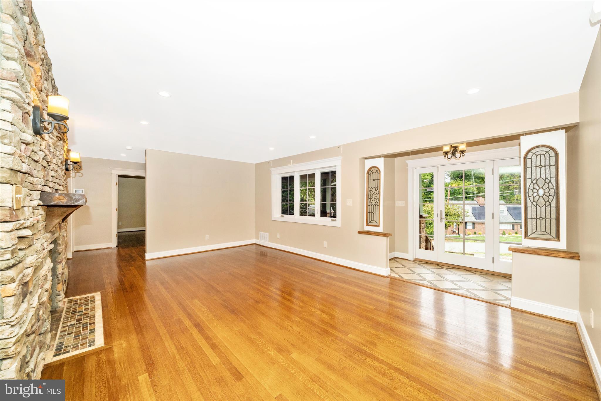 1925 Pagebrook Road Silver Spring, MD 20903 - Photo 4 of 60 a view of an empty room with wooden floor and a window