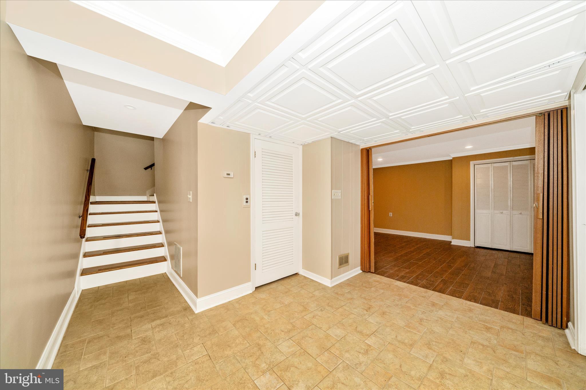 1925 Pagebrook Road Silver Spring, MD 20903 - Photo 42 of 60 a view of a room with a staircase and a white door