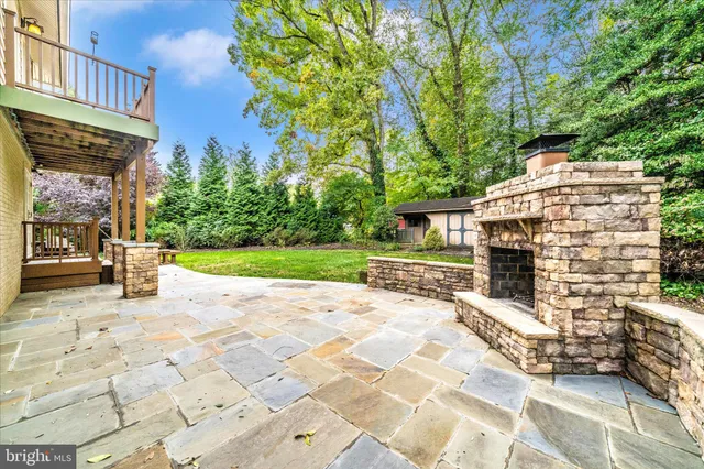 a view of a porch with a table and chairs