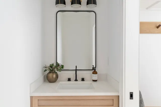 a bathroom with a sink and a mirror
