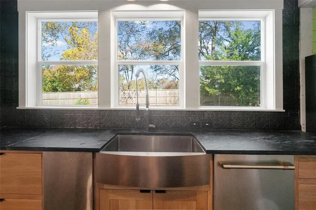 a kitchen with a sink and a window