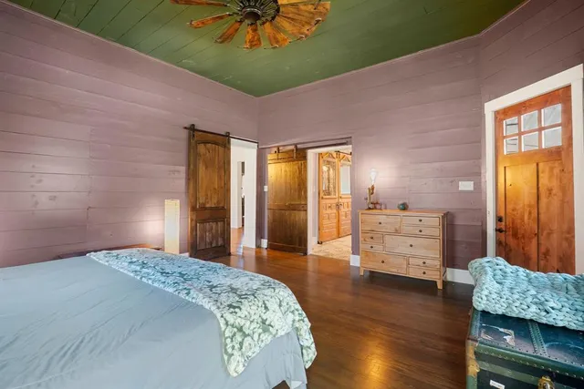 a living room with furniture a table and a large window