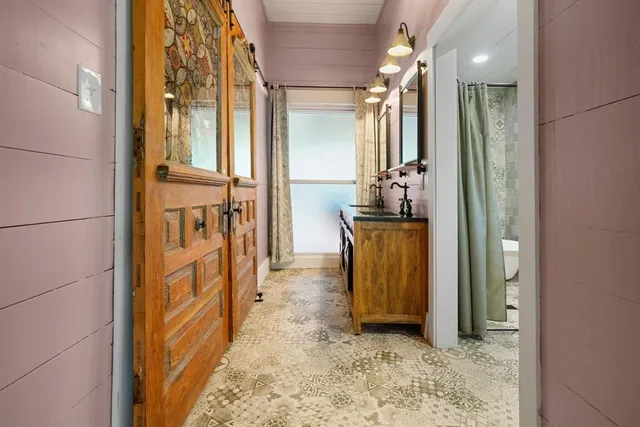 a bathroom with a sink and a mirror