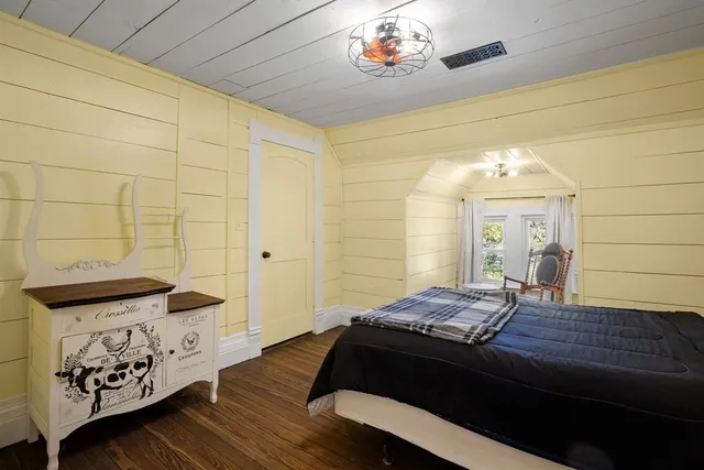 a view of a livingroom with furniture window and wooden floor