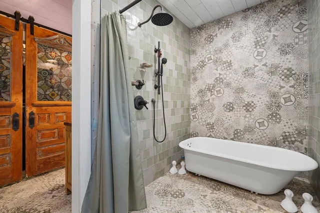 a bathroom with a toilet and shower