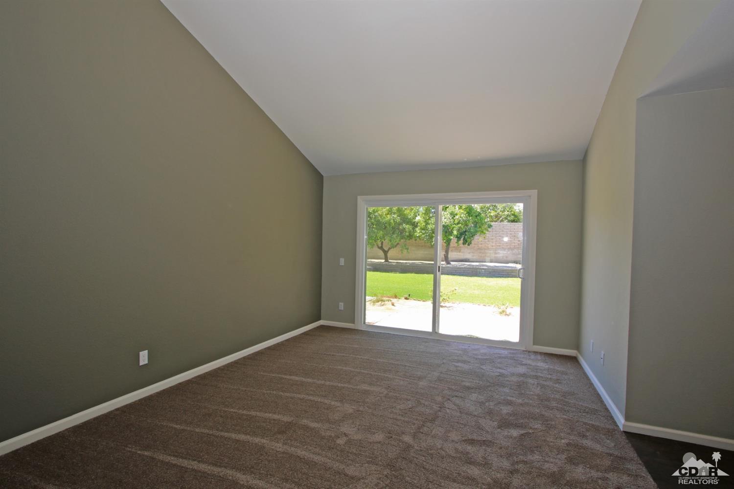 73733 Haystack Road Palm Desert, CA 92260 - Photo 18 of 36 a view of an empty room with a window