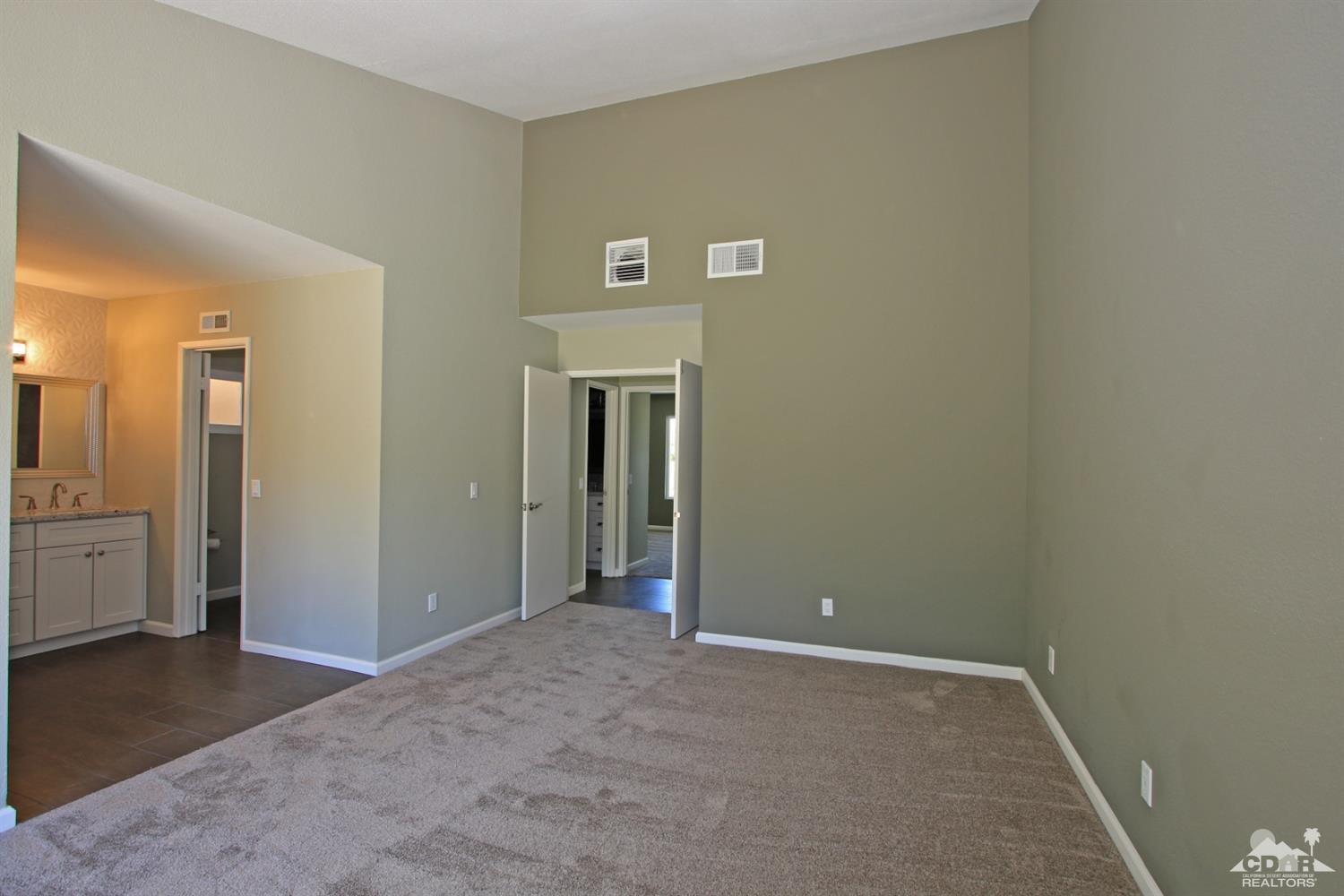 73733 Haystack Road Palm Desert, CA 92260 - Photo 20 of 36 an empty room with closet and a bathroom