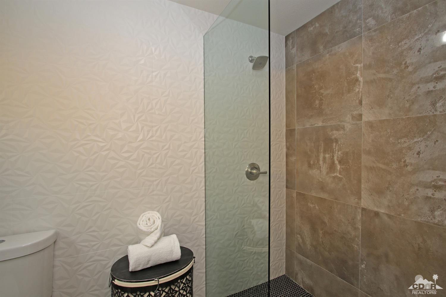 73733 Haystack Road Palm Desert, CA 92260 - Photo 23 of 36 a bathroom with a toilet and a mirror