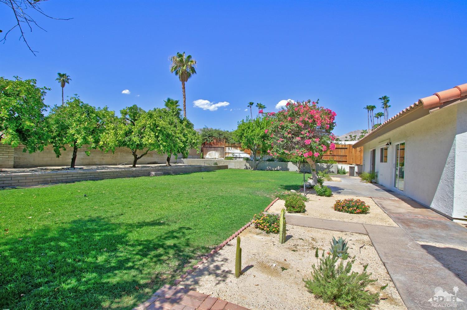 73733 Haystack Road Palm Desert, CA 92260 - Photo 26 of 36 a front view of a house with a yard