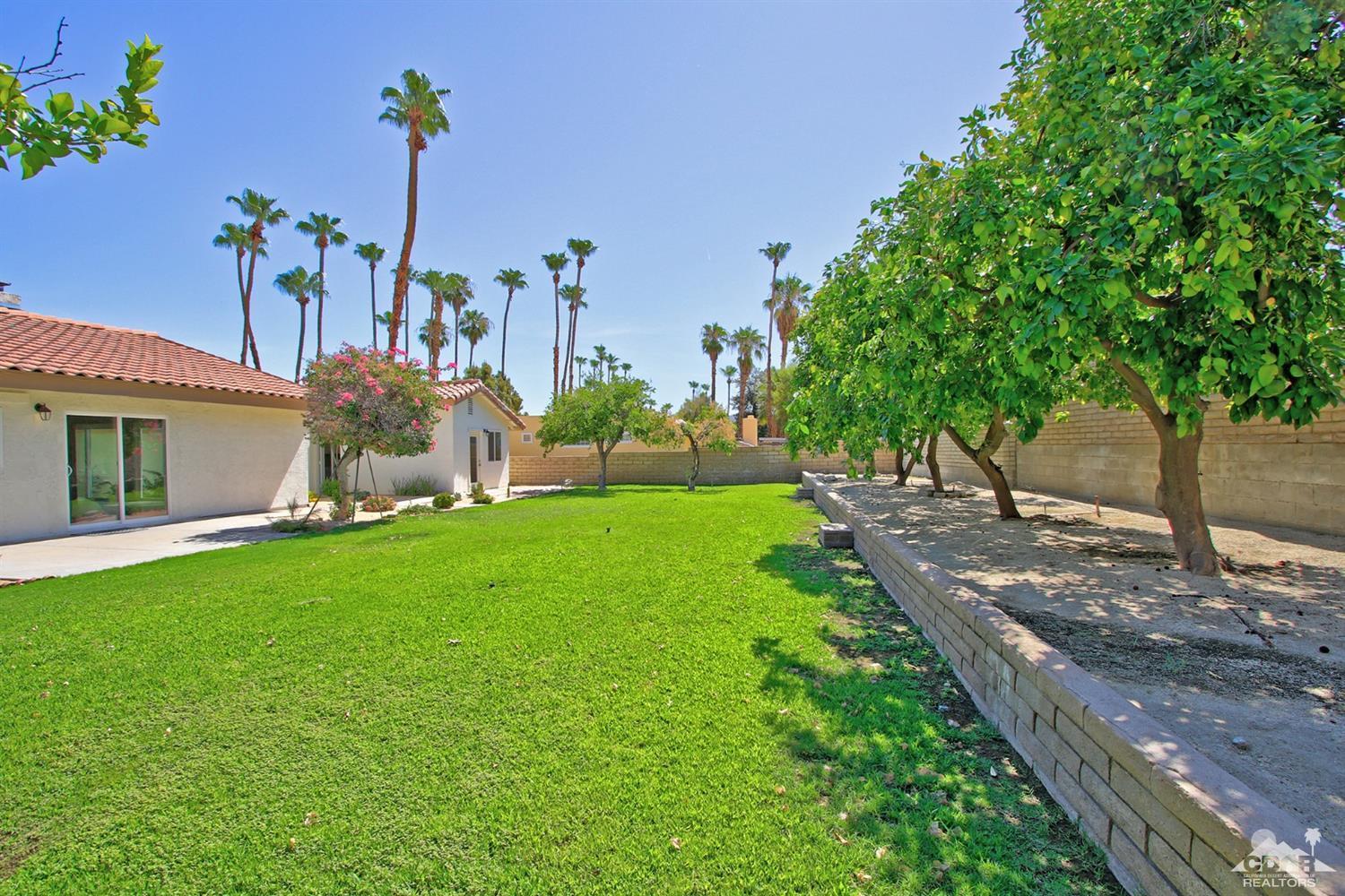 73733 Haystack Road Palm Desert, CA 92260 - Photo 30 of 36 a front view of a house with garden