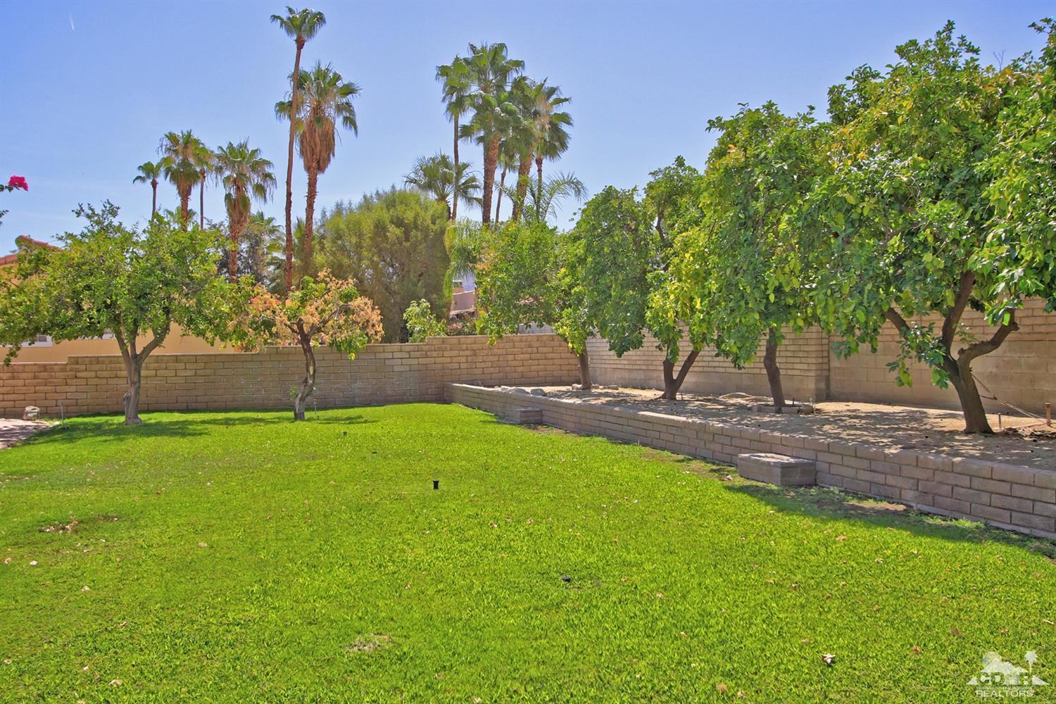 73733 Haystack Road Palm Desert, CA 92260 - Photo 32 of 36 a backyard of a house with lots of green space