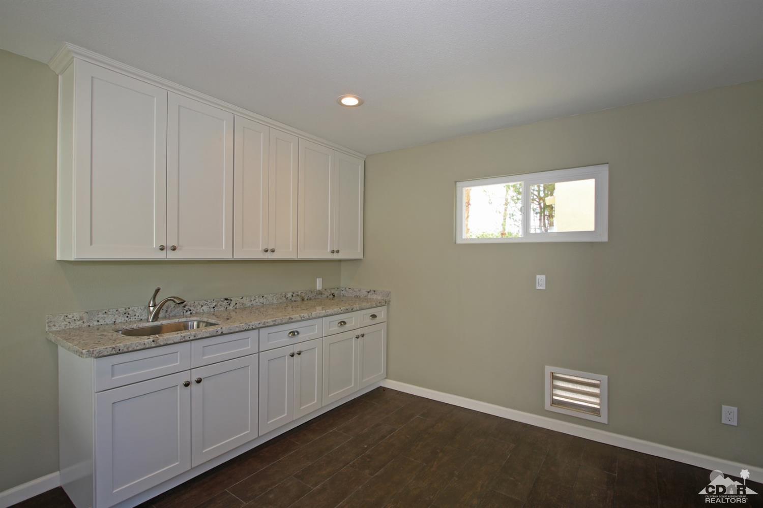 73733 Haystack Road Palm Desert, CA 92260 - Photo 34 of 36 a room with cabinets and window